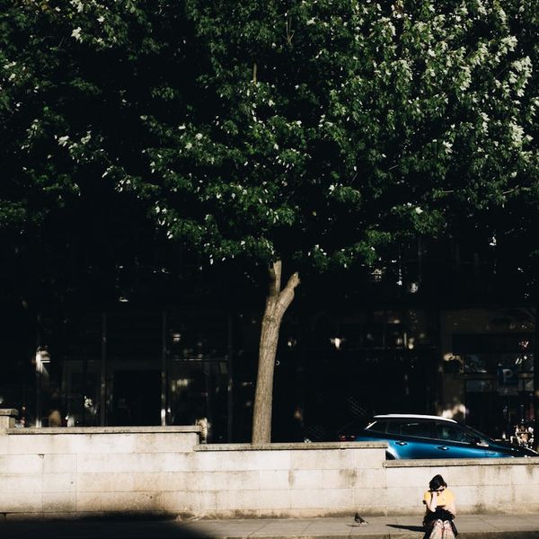 Person meditating peacefully in a calm, modern environment.